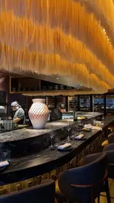 A polished, fast-paced montage showcasing the interior, food, drinks, and atmosphere of Los Mochis in London. The video features high-quality shots of sushi, ceviche, truffle crispy rice, and cocktails, set to music with text overlays highlighting the venue as a 'sexy girl dinner' spot.