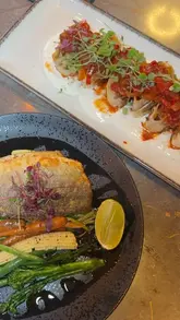 A short video review of The Sultan in Cardiff Bay, showcasing the restaurant's interior and a variety of dishes from their fixed menu, including meze, seabass, lamb sarma beyti, and desserts.