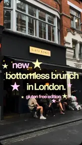 A short, engaging reel showcasing a bottomless brunch experience at Dirty Bones in London, with a specific focus on their gluten-free menu options. The video features shots of the menu, the venue's interior, and various food and drink items.