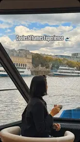 A montage video showcasing an afternoon tea experience on a boat cruising along the River Thames in London. The video features shots of the boat's interior, the passing London skyline, and the afternoon tea service including sandwiches, scones, and cakes.