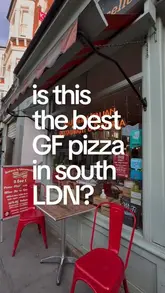 A short, punchy review of Amore & Limoncello in Fulham, focusing on their gluten-free pizza and pasta offerings. The video uses text overlays to pose a question about the quality of the food, followed by shots of the menu, the pizza being cut, and a final shot of limoncello shots.