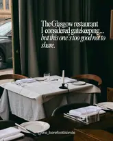 A clean, atmospheric shot of a restaurant table setting used to introduce a recommendation for a restaurant in Glasgow.