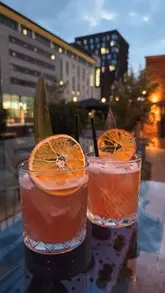 A creator visits four different venues in Coventry to showcase their participation in 'Coventry Cocktail Week,' highlighting the cocktails and atmosphere at each location.