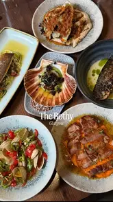 A short promotional video for The Bothy in Glasgow, showcasing their new sharing menu with various dishes like scallops, mackerel, lamb, and roasted cabbage in a cozy, traditional setting.