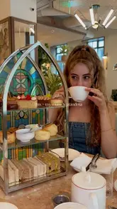 A video showcasing an afternoon tea experience at Rycrofte's, The Derby London City, featuring the venue's interior, the tea stand, and the food.