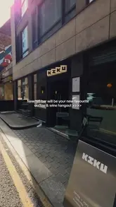 A short, aesthetic montage showcasing Kiku, a new venue in Liverpool that functions as a coffee shop by day and a hi-fi music bar by night. The video highlights the interior design, record player setup, coffee, pastries, and evening atmosphere.