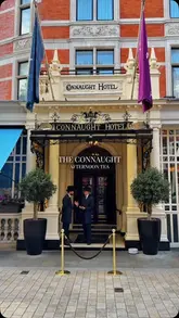 A montage video showcasing the afternoon tea service at The Connaught Hotel in London. The video features shots of the hotel exterior, the elegant interior, the tea service, and close-ups of the sandwiches, scones, and pastries.