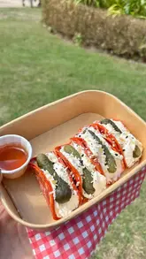 A vlog-style video documenting a visit to a pop-up market at the Palm House in Sefton Park, featuring various food vendors including charcuterie tacos, lemonade, and ice cream.