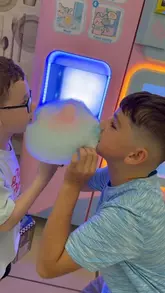 A family vlog documenting a day out at Livingston Designer Outlet, featuring shopping at Crocs and Next, playing at the Flip Out trampoline park, and eating at the food court.