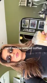A short, aesthetic reel featuring a creator visiting a coffee shop, focusing on the preparation of an iced coffee and the overall atmosphere.