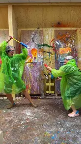A vlog-style video showing a mother and daughter visiting a splatter art studio in Manchester, detailing the preparation process, the experience of throwing paint, and the final artwork.