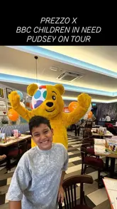 A vlog-style video showcasing a family-friendly 'Pudsey on Tour' event at a Prezzo restaurant, featuring activities like face painting, games, and a meal.