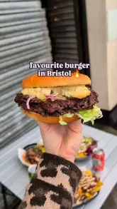 A short, fast-paced montage showcasing the preparation of a smash burger, from the raw mince being smashed on the grill to the final assembly with toppings.