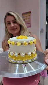 A vlog-style video showcasing a cake decorating experience at Sprinkle Studio in the Metro Centre, where the creator demonstrates the process of decorating a bento cake and tries their drinks.