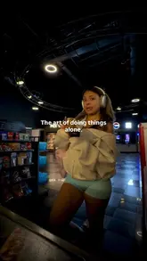 A lifestyle montage featuring a creator enjoying solo dates at various venues, including a brunch spot and a bar, set to music with text overlays.