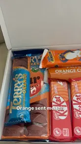 A creator unboxes a 'Terry's Chocolate Orange' themed treat box and uses the contents to bake a chocolate orange banana bread at home.