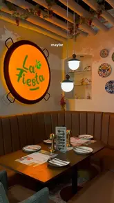 A creator visits La Fiesta in Leeds to showcase their all-you-can-eat Mediterranean small plates concept. The video demonstrates the ordering process via tablet, highlights the buffet selection, and features several dishes including garlic mushrooms, beef brisket, and tiramisu.