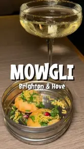 A promotional reel showcasing the relaunch of Mowgli restaurant in Brighton, featuring shots of the refurbished interior, cocktails, and a variety of Indian street food dishes served at the event.