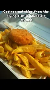 A video review of a fish and chip shop in Sheffield called The Flying Fish. The creator shares their experience of buying cod roe and chips, highlighting the friendly service and the specific items they purchased. The video includes shots of the shop exterior, the display case, and an unboxing of the food in a car.