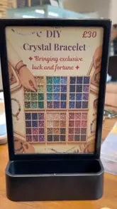A video showcasing Serendipity Crystal Cafe, highlighting their brunch menu and bracelet-making activity.