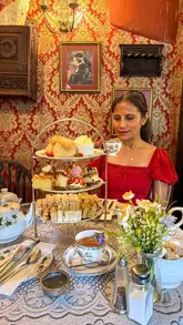 A visually appealing, polished reel showcasing a traditional afternoon tea experience at The Bridge Tea Rooms in Bradford-on-Avon, highlighting the historic decor and classic tea service.
