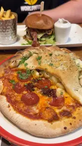 A review of a visit to Frankie & Benny's, highlighting specific menu items like the giant mozzarella stick, steakhouse burger, calizza, and cookie dough, while also promoting their summer rewards scheme.