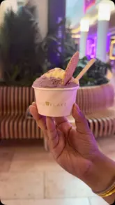 A short promotional video showcasing the gelato and popsicle selection at Snowflake Gelato, featuring close-ups of the colourful fruit-shaped popsicles and a cup of gelato.