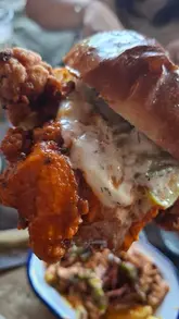 A creator visits The Railway in Ringwood to review their updated menu, featuring BBQ dishes and pub staples like burgers and loaded fries.