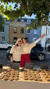 A fast-paced, energetic recap of a cookie pop-up event featuring two creators. The video showcases the baking process, the stall setup, and the interaction with customers, highlighting the popularity of the product.