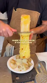 A short, punchy video showcasing the raclette and grilled cheese offerings at Kappacasein in Borough Market, London. The video focuses on the preparation and the visual appeal of the melted cheese.