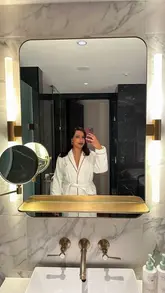 A montage showcasing a boutique hotel stay, highlighting the room amenities, bathroom, and room service dining experience.