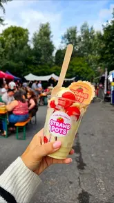 A vibrant, energetic recap of a food festival, featuring a variety of street food vendors, live music, and a family-friendly atmosphere. The creator samples several dishes and highlights the event's welcoming vibe.