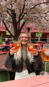 A promotional reel featuring a creator visiting two Belfast venues, Halt and The Boneyard, to showcase their new Aperol Spritz on tap service. The video highlights the ease of pouring the drink, the venue atmosphere including DJs and outdoor seating, and the overall experience.