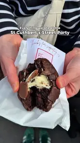 A montage video showcasing various food and retail vendors at the St Cuthbert's Street Party in Bedford, featuring burgers, oysters, cookies, and cinnamon rolls.