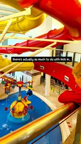 A family-focused travel reel documenting a day out in Stockport, visiting various local attractions including a cinema and entertainment complex, a market cafe, museums, and a swimming pool.