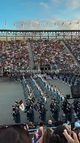 A compilation of clips showcasing the Edinburgh Military Tattoo, featuring marching bands, traditional dancers, and fireworks set against the backdrop of Edinburgh Castle.