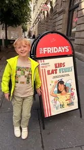 A family-focused vlog showcasing a visit to TGI Fridays, highlighting the 'Kids Eat Free' promotion, the kid-friendly atmosphere, and the staff's interaction with children through balloon animals.