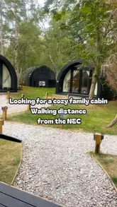 A short video tour of a glamping cabin near the NEC in Birmingham, highlighting the interior amenities and the scenic lakeside location.