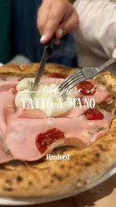 A fast-paced review of a limited-edition pizza at Fatto a Mano, featuring close-ups of the food, sides like arancini and lasagna bites, and shots of the venue's interior and pizza oven.