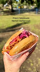 A short montage showcasing the exterior, menu, and various food items at Fran's Bakehouse, including pastries, sausage rolls, and bagels.