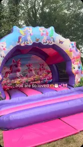 A montage video showcasing a home garden party setup for a 3rd birthday, featuring a bouncy castle, BBQ, and a variety of Indian snacks.