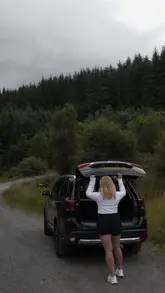 A cinematic, aesthetic montage showcasing a stay at a cottage in the Scottish Highlands, featuring scenic drives, nature views, and cozy indoor moments.