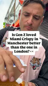 Two creators conduct a candid, conversational review of a chicken burger and wings from Miami Crispy in Manchester, comparing the quality to their previous experience at the London branch.