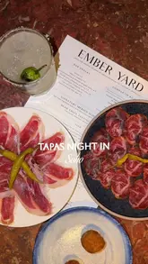 A short, punchy montage showcasing a variety of tapas dishes, cocktails, and the interior of a Soho restaurant, focusing on the visual appeal of the food and the dining experience.