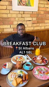 A creator visits The Breakfast Club in St Albans, showcasing the interior and reviewing a variety of breakfast and brunch dishes including the Big American, avocado and halloumi, French toast, and a matcha drink.