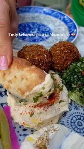 A short, engaging video review of a Lebanese restaurant in Manchester, featuring a set menu experience. The video includes close-up shots of various mezze dishes, main courses, and the venue's interior and exterior, accompanied by a voiceover describing the meal.