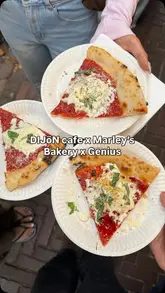 A short, fast-paced video showcasing a collaboration between Genius, Dijon Cafe, and Marley's Bakery in Hampstead, highlighting their gluten-free protein pancakes, pizza, and cookies.