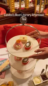 A cinematic showcase of the 'Literary Afternoon Tea' at Hotel Café Royal in London. The video features close-ups of themed pastries, tea and champagne service, and the elegant, historic interior of the venue, including a live piano performance.
