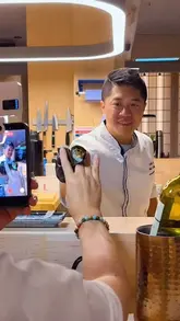 A montage of high-end sushi preparation at Maki Nori Soho, featuring a chef performing omakase-style techniques, including blowtorching, plating, and dry ice presentation. The video highlights the precision and artistry involved in the food preparation, ending with a customer enjoying a piece of sushi.