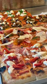A short, visually appealing montage showcasing Fico Deli in Guisborough, highlighting their pizza al taglio, small plates, and cozy interior.